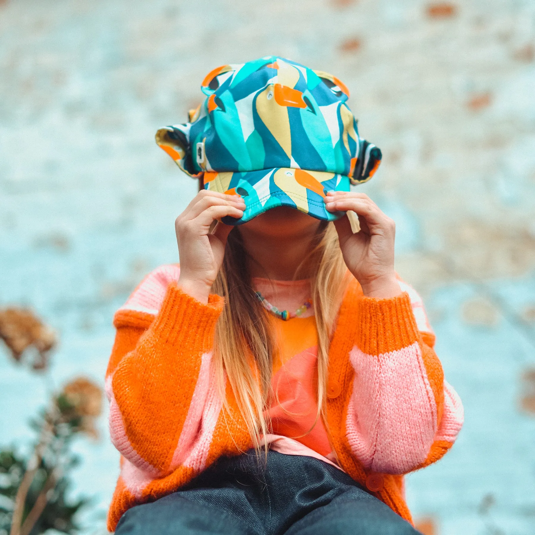 Kids Cub hat with neck flap: Toucan Play
