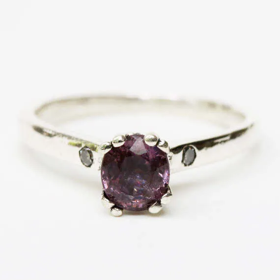 Purple spinel ring in prongs setting and diamond side set with sterling silver band