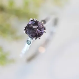 Purple spinel ring in prongs setting and diamond side set with sterling silver band