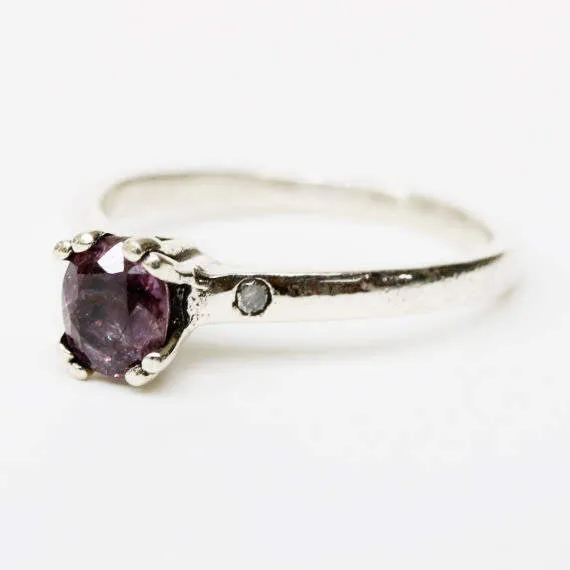 Purple spinel ring in prongs setting and diamond side set with sterling silver band